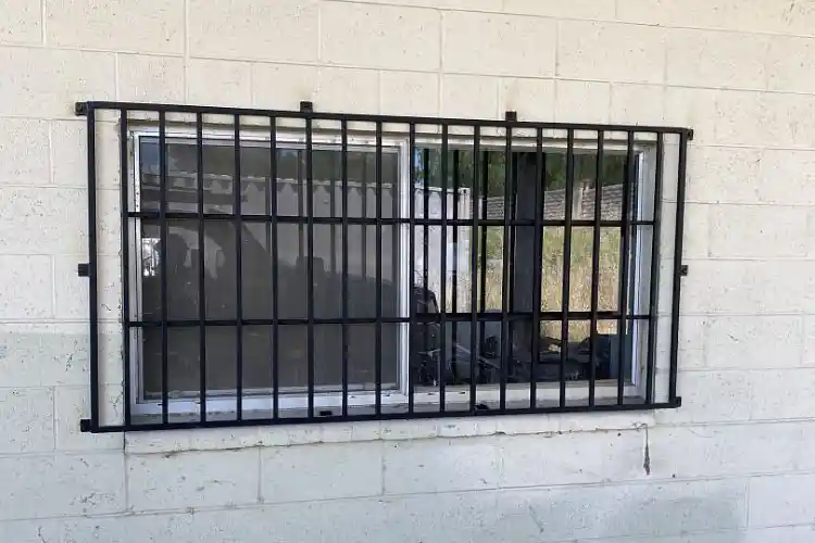 Metal barring for securing windows from outside intruders, built by Navarro Metalworks